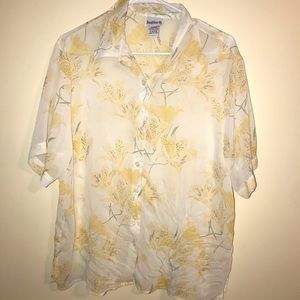 Yellow flowered shirt.